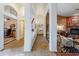 Long hallway with tiled floors and archways leading to other rooms at 16364 W Roosevelt St, Goodyear, AZ 85338