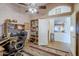 Home office with built-in shelving and desk at 16364 W Roosevelt St, Goodyear, AZ 85338