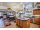 Kitchen boasts an island, ample cabinetry, and a large window at 16364 W Roosevelt St, Goodyear, AZ 85338