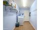 Laundry room with washer, dryer, and storage at 16364 W Roosevelt St, Goodyear, AZ 85338