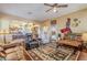 Open living room with views into kitchen and backyard at 16364 W Roosevelt St, Goodyear, AZ 85338