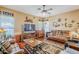 Living room with comfortable seating and large TV at 16364 W Roosevelt St, Goodyear, AZ 85338