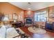 Cozy living room with brick fireplace and hardwood floors at 16364 W Roosevelt St, Goodyear, AZ 85338