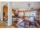 Open living and dining area with hardwood floors and fireplace at 16364 W Roosevelt St, Goodyear, AZ 85338