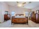 Main bedroom with wood furniture and ceiling fan at 16364 W Roosevelt St, Goodyear, AZ 85338
