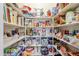 Well-stocked pantry with ample shelving for storage at 16364 W Roosevelt St, Goodyear, AZ 85338