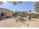 Patio area with seating and umbrella at 16364 W Roosevelt St, Goodyear, AZ 85338