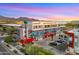Modern building complex with vibrant mural art and sculpture at 16510 N 92Nd St # 1006, Scottsdale, AZ 85260