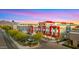 Modern building complex with vibrant mural art near a street at 16510 N 92Nd St # 1006, Scottsdale, AZ 85260