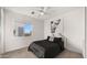 Cozy bedroom with a queen bed and large window at 16510 N 92Nd St # 1006, Scottsdale, AZ 85260