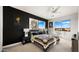 Primary bedroom with king-size bed and dark accent wall at 16510 N 92Nd St # 1006, Scottsdale, AZ 85260