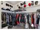 Large walk-in closet with ample shelving and hanging space at 16510 N 92Nd St # 1006, Scottsdale, AZ 85260