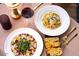 Overhead view of a beautifully arranged gourmet meal featuring pasta, carpaccio, and toasted bread at 16510 N 92Nd St # 1006, Scottsdale, AZ 85260