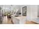 Open kitchen with island and view into dining area at 16510 N 92Nd St # 1006, Scottsdale, AZ 85260