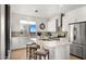 Bright kitchen featuring an island and white cabinetry at 16510 N 92Nd St # 1006, Scottsdale, AZ 85260