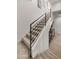 Modern staircase with metal railing and neutral carpet at 16510 N 92Nd St # 1006, Scottsdale, AZ 85260