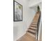 Modern staircase with wood steps and metal railing at 16510 N 92Nd St # 1006, Scottsdale, AZ 85260