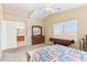 Bright bedroom with double dresser and ensuite bathroom access at 19339 N Madison Rd, Maricopa, AZ 85139