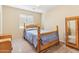 Bedroom with vintage bed and mirrored armoire at 19339 N Madison Rd, Maricopa, AZ 85139