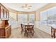 Charming dining room with wood table and chairs at 19339 N Madison Rd, Maricopa, AZ 85139