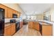 Eat-in kitchen with wood cabinets and granite countertops at 19339 N Madison Rd, Maricopa, AZ 85139