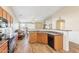 Open kitchen with an island and stainless steel appliances at 19339 N Madison Rd, Maricopa, AZ 85139