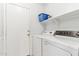 Laundry room with washer, dryer, and shelving at 19339 N Madison Rd, Maricopa, AZ 85139