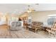 Spacious living room with tile floors and a cozy seating area at 19339 N Madison Rd, Maricopa, AZ 85139