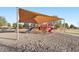 A community playground features multiple slides for residents to enjoy outdoor activities at 19339 N Madison Rd, Maricopa, AZ 85139