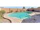 Inviting kidney-shaped pool in backyard at 19339 N Madison Rd, Maricopa, AZ 85139