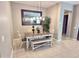Inviting dining area featuring a wooden table, bench seating, and a decorative mirror at 210 E Bergamot Ln, Queen Creek, AZ 85140