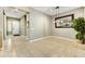 Open dining area with tile floors, neutral walls, and modern light fixture at 210 E Bergamot Ln, Queen Creek, AZ 85140