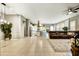 Open-concept living area with tile floors, island kitchen and comfortable seating at 210 E Bergamot Ln, Queen Creek, AZ 85140