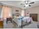 Bright bedroom with a full-size bed and ceiling fan at 21409 N 33Rd Dr, Phoenix, AZ 85027