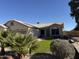 One-story house with two-car garage, landscaping, and a grassy yard at 21409 N 33Rd Dr, Phoenix, AZ 85027