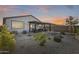 Covered patio and well-landscaped backyard with gravel at 2156 W Sierra Sunset Trl, Phoenix, AZ 85085