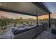 Covered patio with seating area, desert landscaping, and mountain views at 2156 W Sierra Sunset Trl, Phoenix, AZ 85085