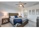 Spacious bedroom with wood bed frame and ensuite bathroom at 2156 W Sierra Sunset Trl, Phoenix, AZ 85085