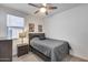 Bedroom with a bed, nightstand, and ceiling fan at 2156 W Sierra Sunset Trl, Phoenix, AZ 85085