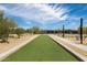 Community bocce ball court with artificial turf and surrounding landscaping at 2156 W Sierra Sunset Trl, Phoenix, AZ 85085
