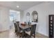 Bright dining room with dark wood table and six chairs at 2156 W Sierra Sunset Trl, Phoenix, AZ 85085