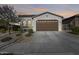 Single-story home with a two-car garage and desert landscaping at 2156 W Sierra Sunset Trl, Phoenix, AZ 85085