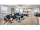 Living room with L-shaped sectional sofa and open kitchen at 2156 W Sierra Sunset Trl, Phoenix, AZ 85085
