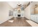 Sunlit living area with vaulted ceiling, fireplace, and lots of natural light at 2331 W Comstock Dr, Chandler, AZ 85224