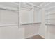 Spacious walk-in closet with shelving and hanging rods at 24623 S Lakeway Se Cir, Sun Lakes, AZ 85248