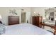 Bedroom with a king-size bed and two dressers at 25244 S Saddletree Dr, Sun Lakes, AZ 85248