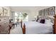 Spacious bedroom with a king-size bed and access to a patio at 25244 S Saddletree Dr, Sun Lakes, AZ 85248