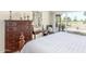 Main bedroom with king bed, dresser, and patio access at 25244 S Saddletree Dr, Sun Lakes, AZ 85248