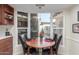 Cozy breakfast nook with a round table and built-in window seat at 25244 S Saddletree Dr, Sun Lakes, AZ 85248