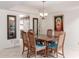 Dining room with wood table and chairs, kitchen access at 25244 S Saddletree Dr, Sun Lakes, AZ 85248